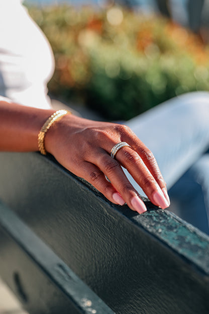 Be extra ring on model hand paired with risk taker bracelet