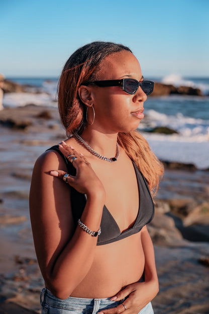 Model wearing Onyx Necklace, Onyx Bracelet, Silver Amor banded ring set and Silver Classic Hoop earrings