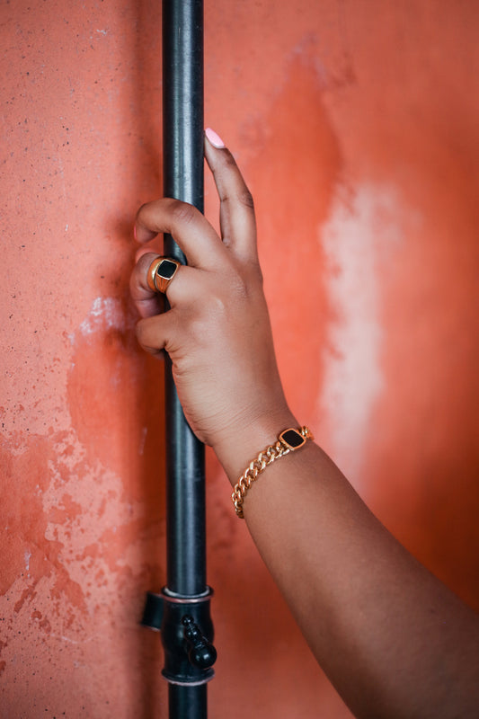 Onyx Ring and onyx bracelet on model arm 