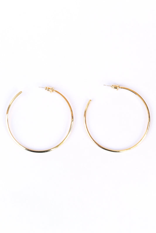 Gold Modern hoop earrings on a white backdrop