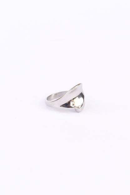 45 degree side view of silver love open ring on white backdrop