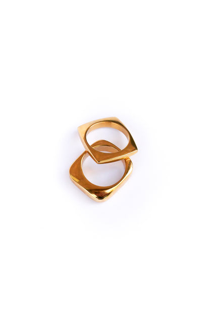 Two out of the box rings on a white backdrop